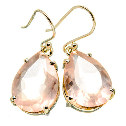 Rose quartz teardrop earrings with gold-tone hooks and faceted pink stones