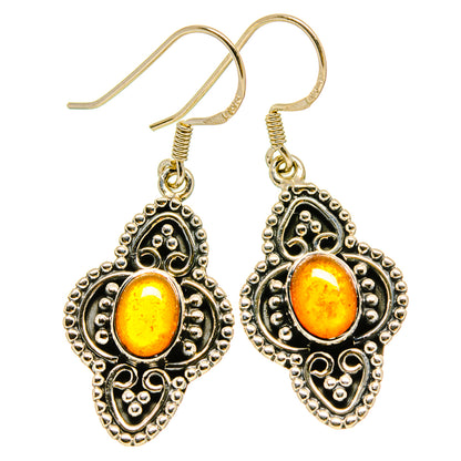 Silver-tone heart drop earrings with orange carnelian stones and beaded filigree