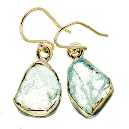 Pair of rough aquamarine earrings with gold-tone frames, dangling bezel-set teardrop stones