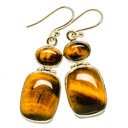 Teardrop tiger eye dangle earrings with silver bezel settings and hook backs