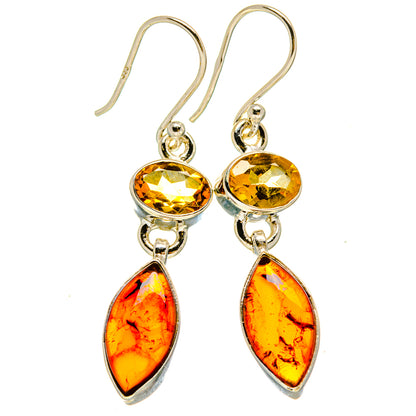 Sterling silver dangle earrings with round yellow tops and amber teardrop drops