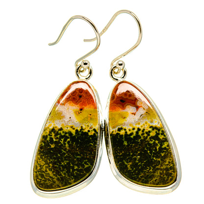 Silver-tone teardrop earrings with wire hooks and orange-green stone, bezel-set.