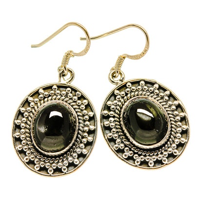 Sterling silver drop earrings with dark green oval diopside and beaded bezel