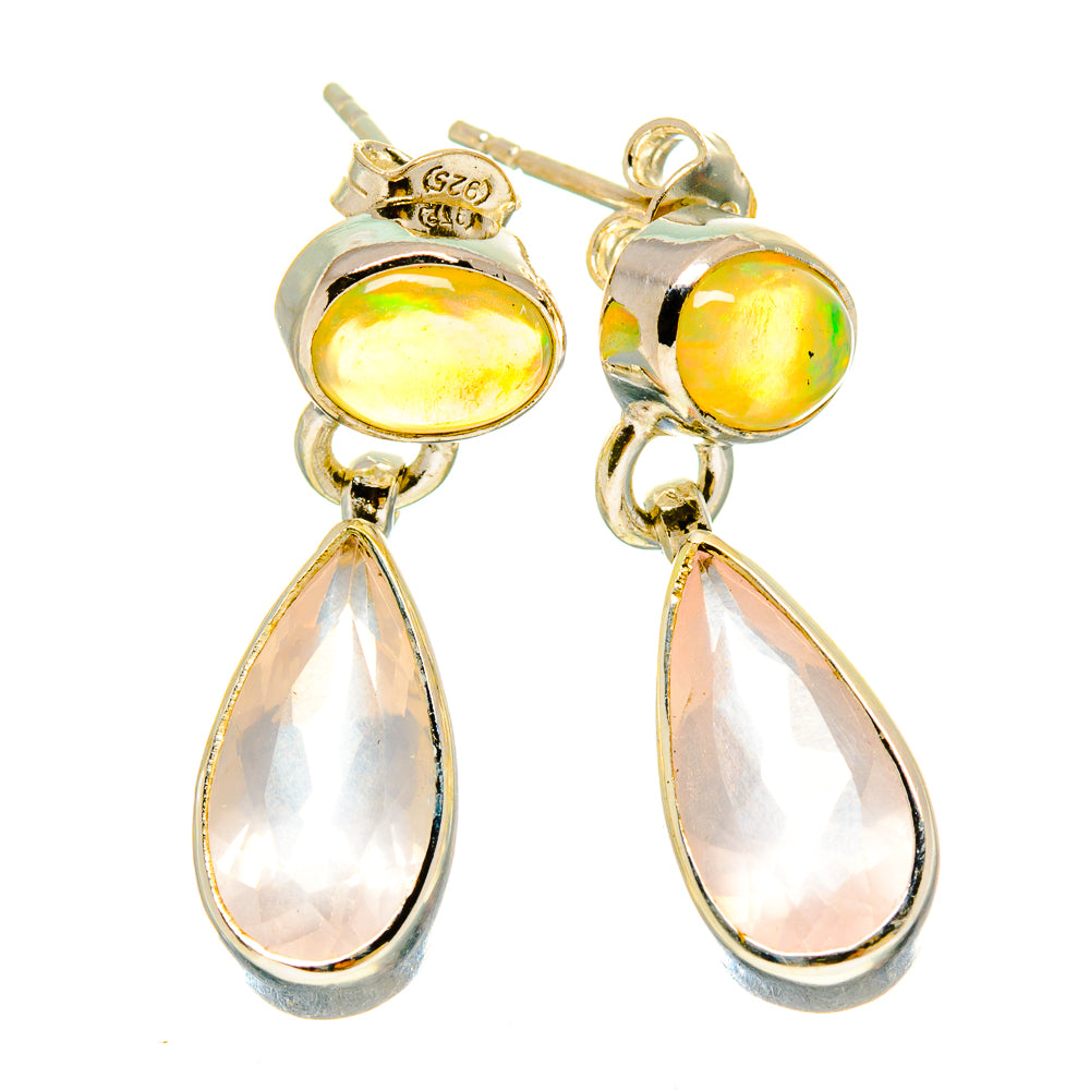 Gold and silver teardrop dangle earrings with oval yellow top stones and pale pink drops