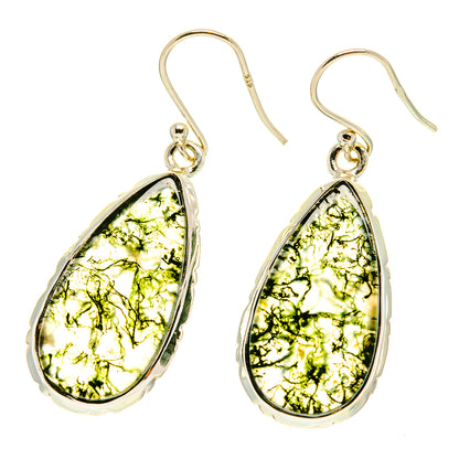 Silver-tone teardrop earrings with moss agate drops, bright green resin patterns.