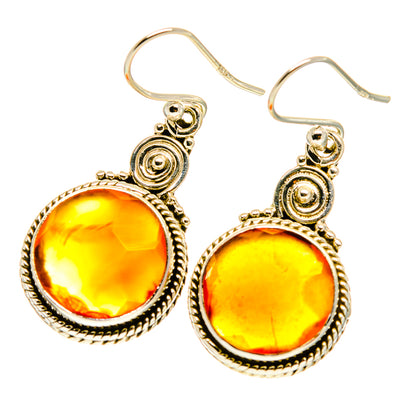 Round orange carnelian earrings in decorative sterling silver settings, fishhook style