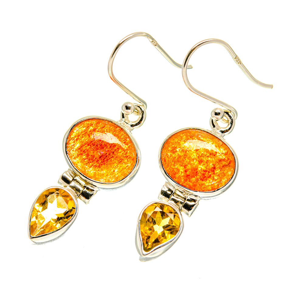 Dangle earrings with orange round gemstone and yellow teardrop gemstone on silver hooks