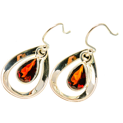 Sterling silver garnet teardrop earrings with red faceted gemstone and loop hooks