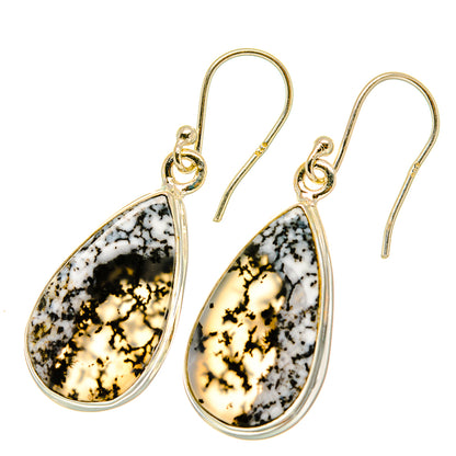Teardrop dendritic opal earrings with gold hooks and pear-shaped stone, black and white speckle.