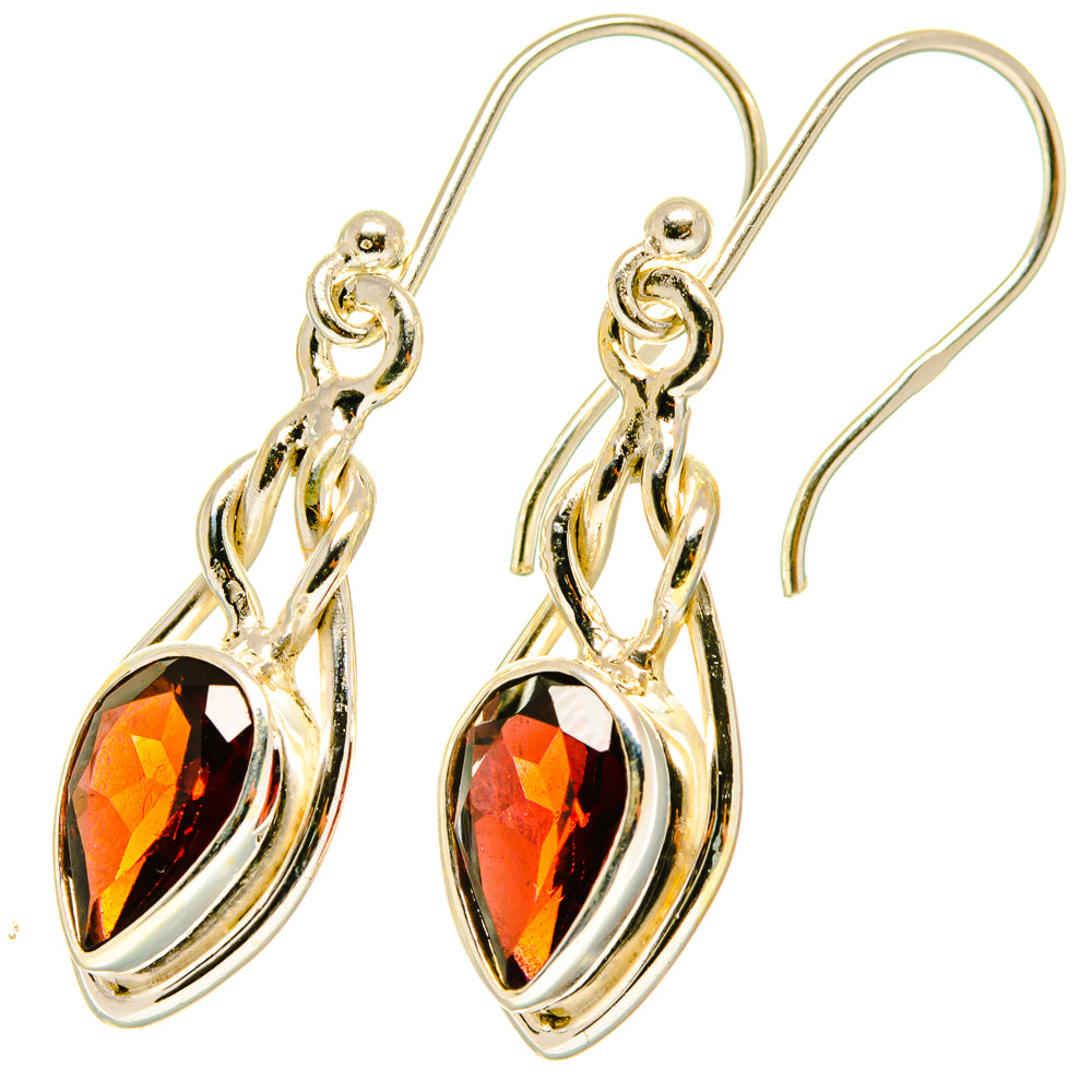 Sterling silver drop earrings with orange-red teardrop garnet stones and loop hooks