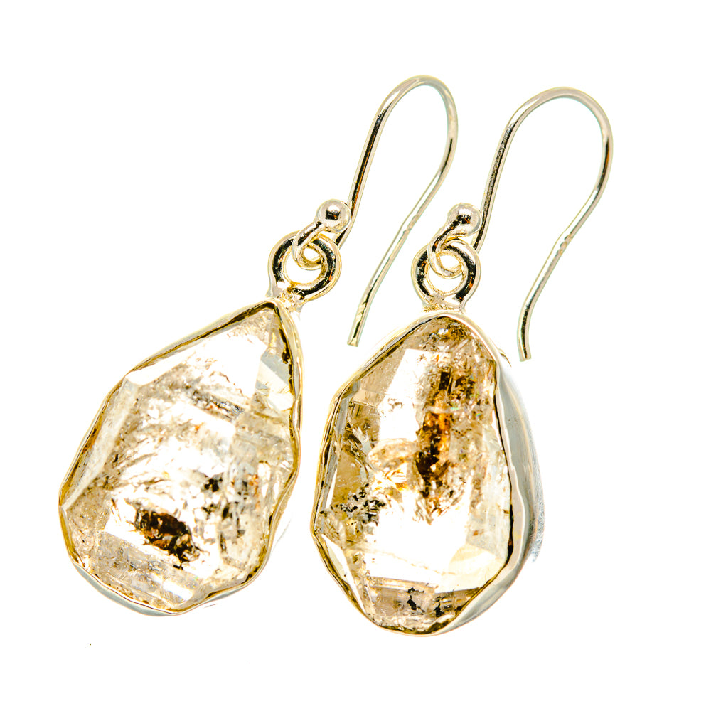 Herkimer diamond earrings with faceted teardrop stones, gold flecks, and silver hook backs
