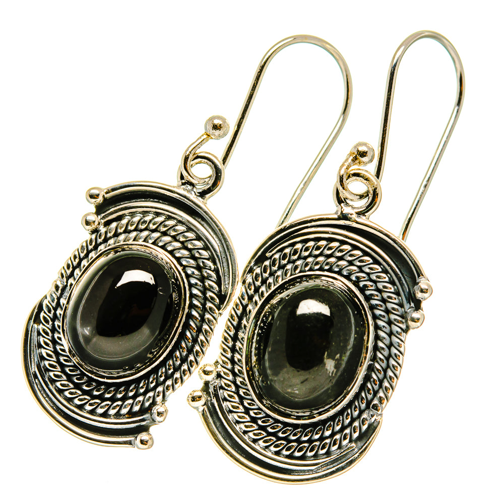 Sterling silver star diopside drop earrings, oval black cabochon with textured round frame