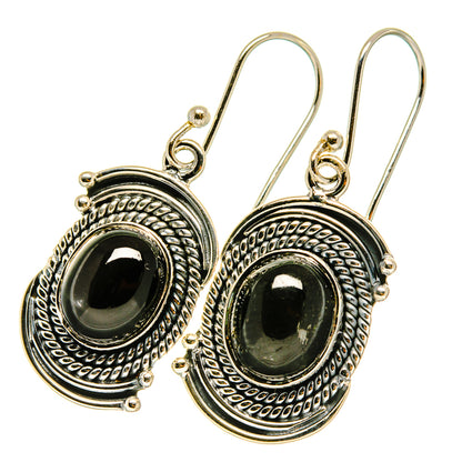 Sterling silver star diopside drop earrings, oval black cabochon with textured round frame