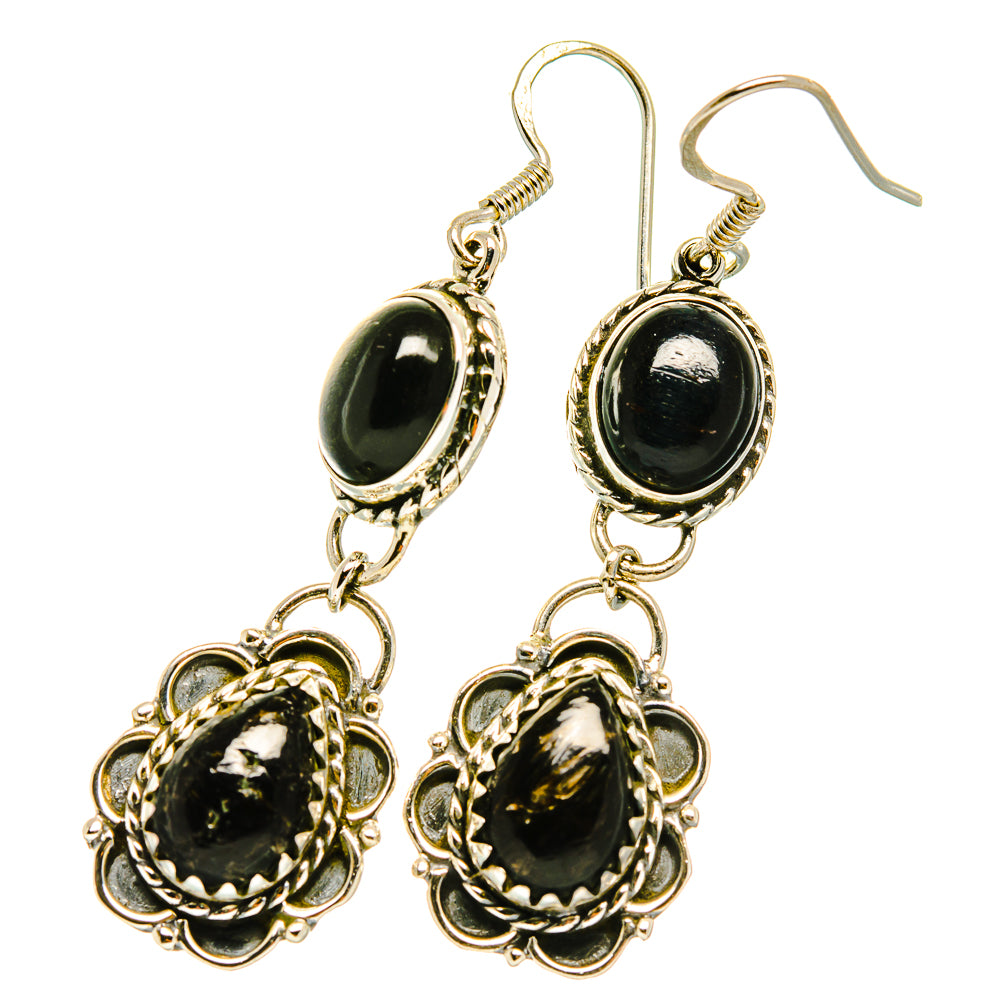 Silver drop earrings with oval black onyx-style stones and ornate flower links