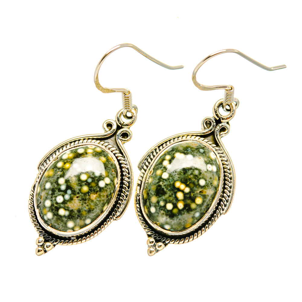 Sterling silver oval gemstone drop earrings with green speckled cabochons and ornate borders