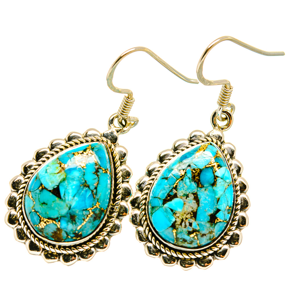 Oval turquoise earrings with ornate silver-tone frame and hook clasp, top view