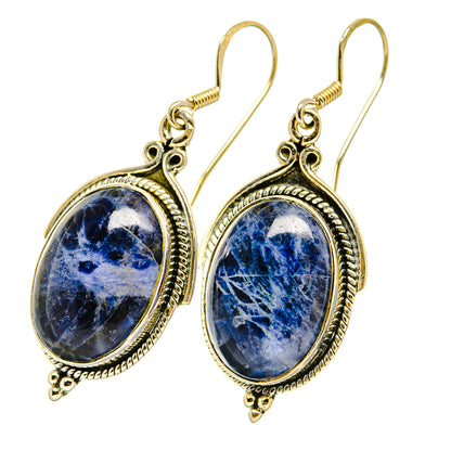 Sodalite oval drop earrings, silver-tone setting, blue faceted stone with textured rim