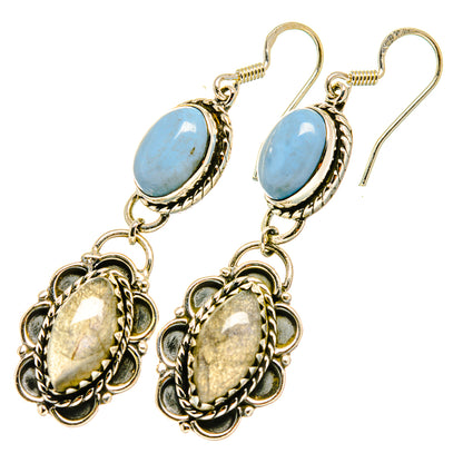 Gold-tone oval blue gemstone drop earrings with ornate lower charms