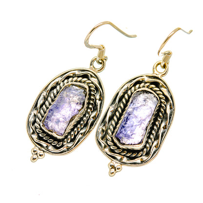 Sterling silver tanzanite drop earrings with two oval rough purple stones and hook backs