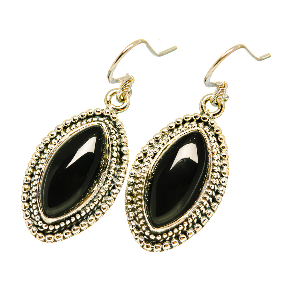 Oval black gemstone drop earrings with ornate bezel and French hook backs