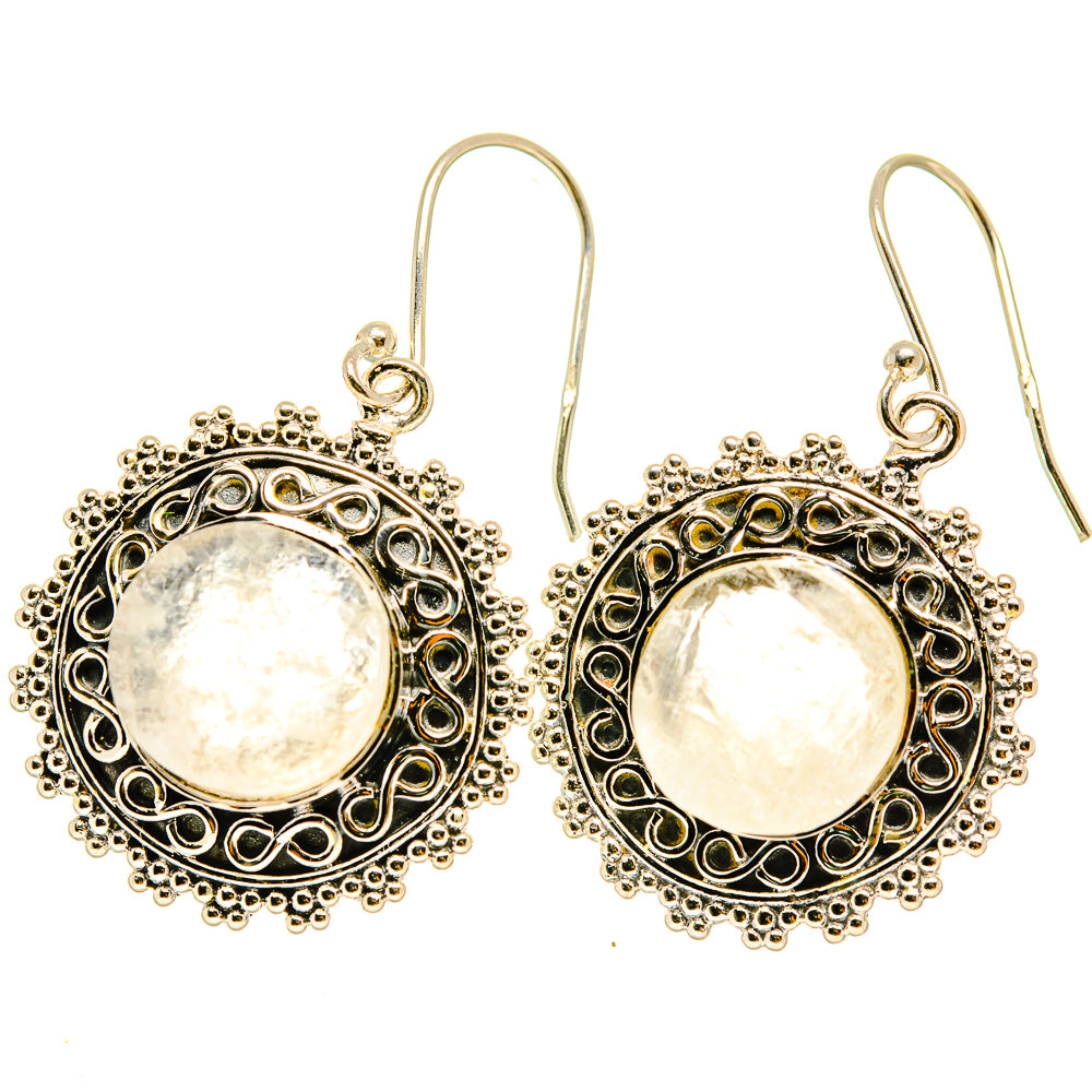 Round moonstone cabochon dangle earrings, ornate silver-tone halo, lever hooks