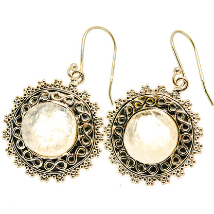 Round moonstone cabochon dangle earrings, ornate silver-tone halo, lever hooks
