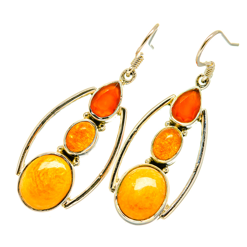 Sterling silver dangle earrings with orange oval and teardrop stones in curved frames