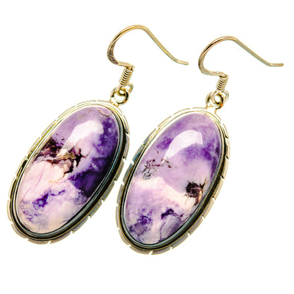 Purple oval stone drop earrings with sterling silver hooks and gold-tone settings