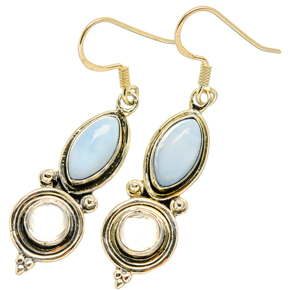 Rainbow moonstone earrings with oval blue opal and round white center, silver-tone hooks