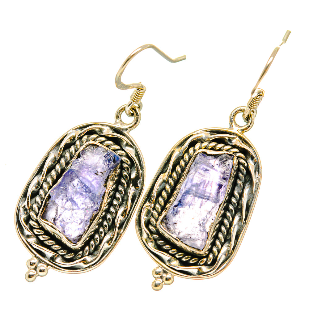 925 sterling silver drop earrings with rough purple tanzanite stones in ornate oval frames