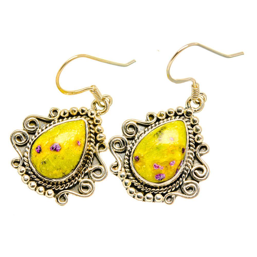 Sterling silver drop earrings with yellow teardrop stone, purple speckles, curved hooks