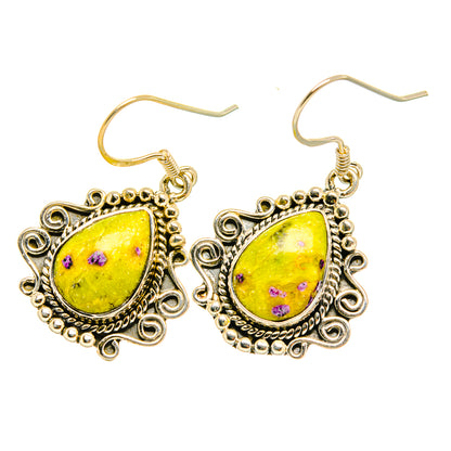Sterling silver drop earrings with yellow teardrop stone, purple speckles, curved hooks