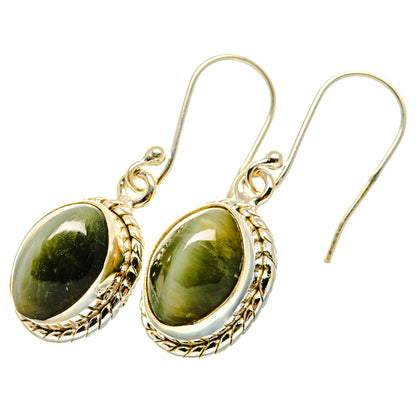 Sterling silver cat’s eye earrings with oval green cabochon and decorative bezel, hooks