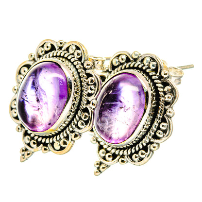 Amethyst 925 sterling silver stud earrings with oval purple gemstones, detailed filigree settings
