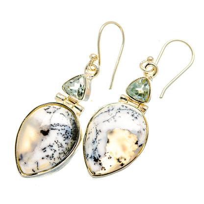 Sterling silver drop earrings with white dendritic opal pear stones and blue topaz accents