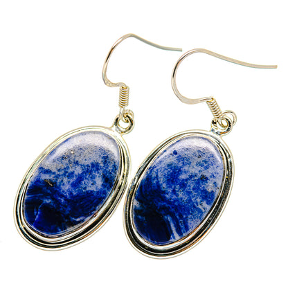 Sterling silver drop earrings with oval blue sodalite stones, gold-tone bezel