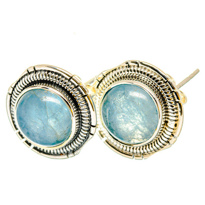 Aquamarine stud earrings in round silver settings with blue gemstone cabochons