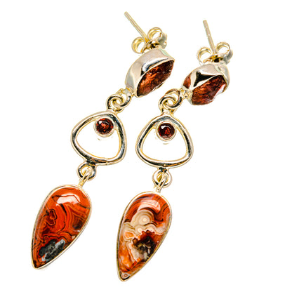 Gold-tone dangle earrings with orange-brown marbled teardrops and red round cabochons