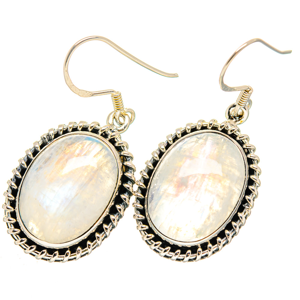Oval moonstone earrings with sterling silver hooks and ornate beaded oval frames