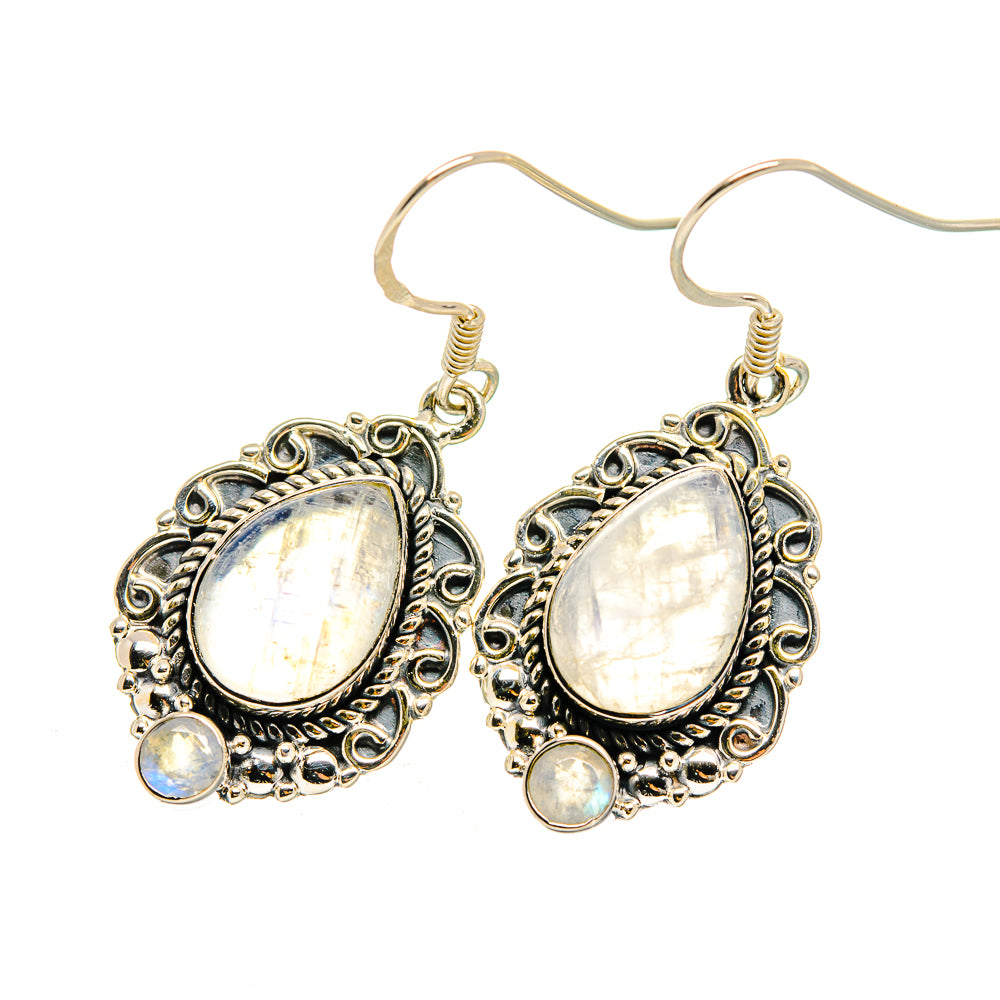 Silver moonstone drop earrings with oval white stones and blue accent gems