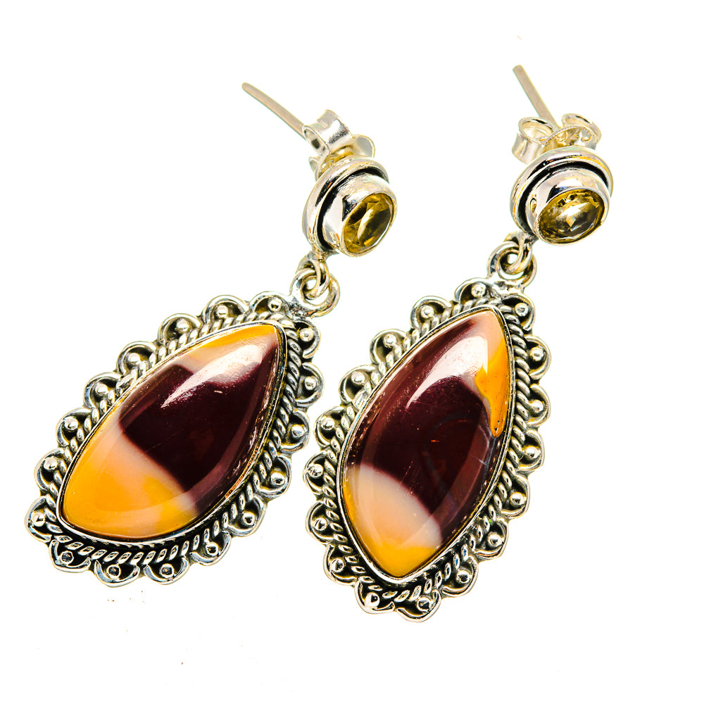 Sterling silver drop earrings with marbled amber cabochons and scalloped settings