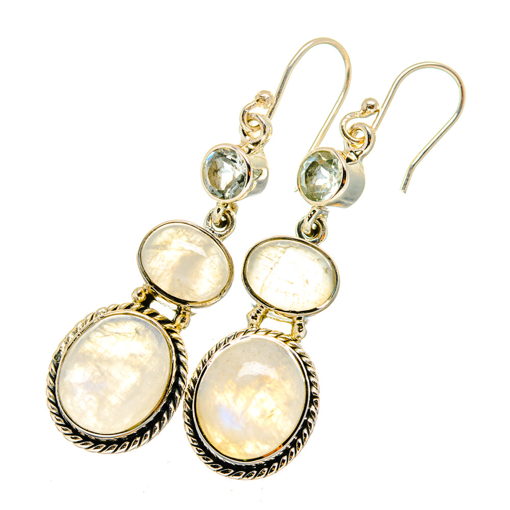 Three-stone dangle earrings with opalescent moonstone discs and small blue top stone