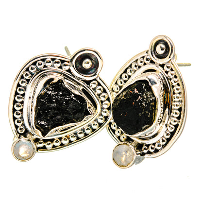 Sterling silver drop earrings with rough black oval stones, beaded halos, and moonstone dangles