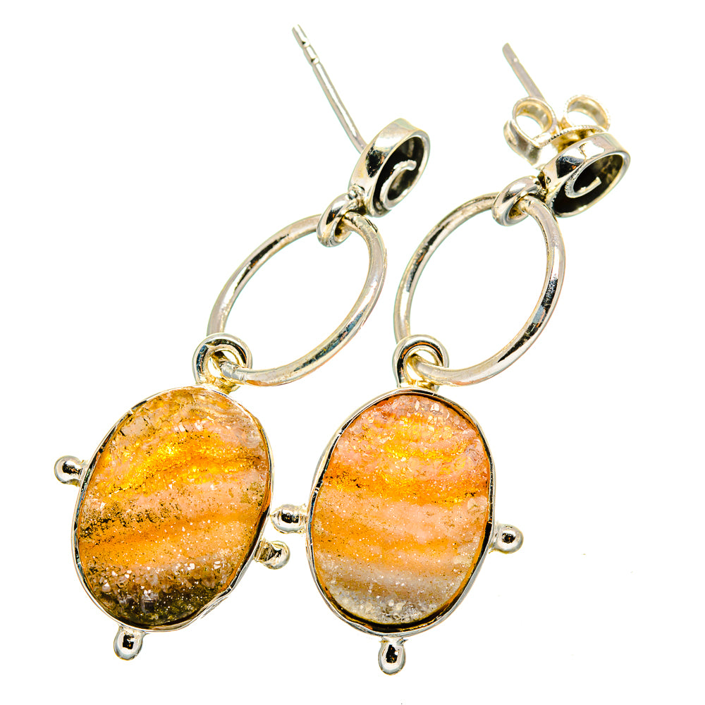 Oval druzy earrings with orange-peach stone drops and silver hoop links, ear wires