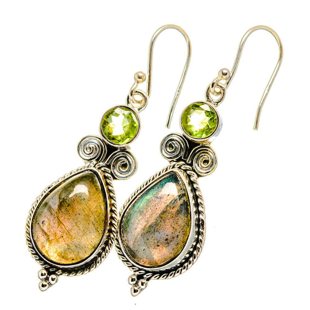 Pair of peridot and labradorite drop earrings with silver scrollwork and hook closures