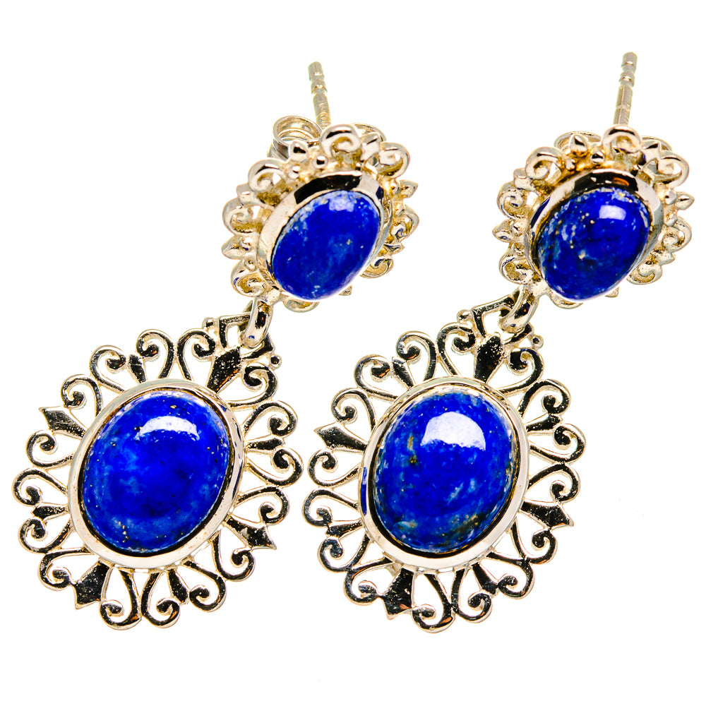 Lapis lazuli drop earrings with blue oval stones and ornate gold-tone filigree