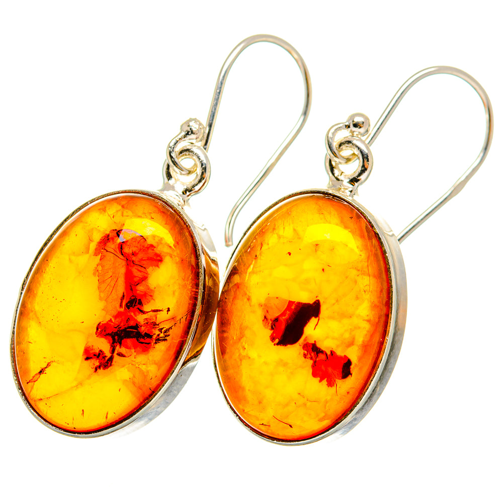 Oval amber drop earrings with sterling silver hooks and bezel settings