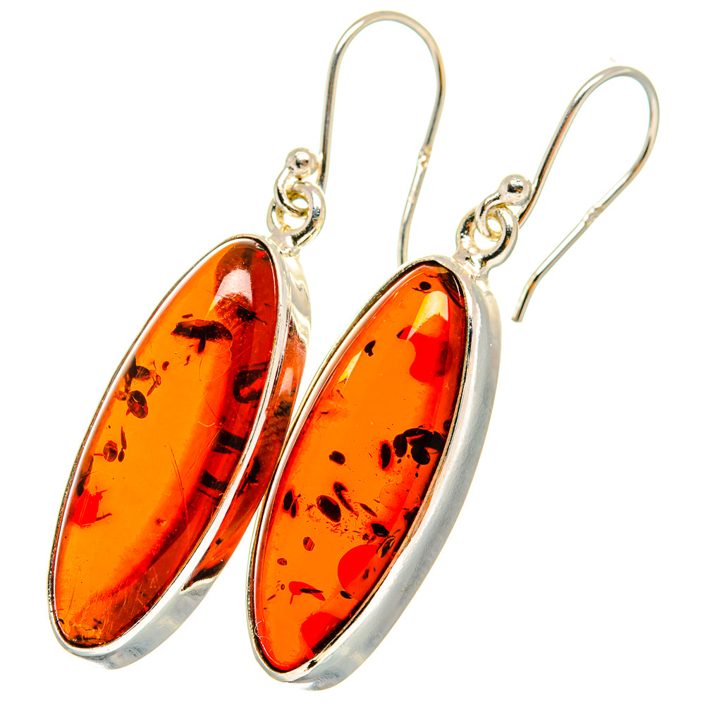 Amber drop earrings with oval red-orange stones, sterling silver hooks