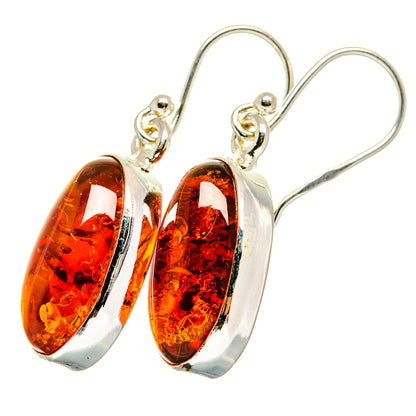 Sterling silver amber oval drop earrings with polished amber cabochons on hook settings