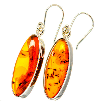 Amber drop earrings with oval orange resin and 925 sterling silver hooks